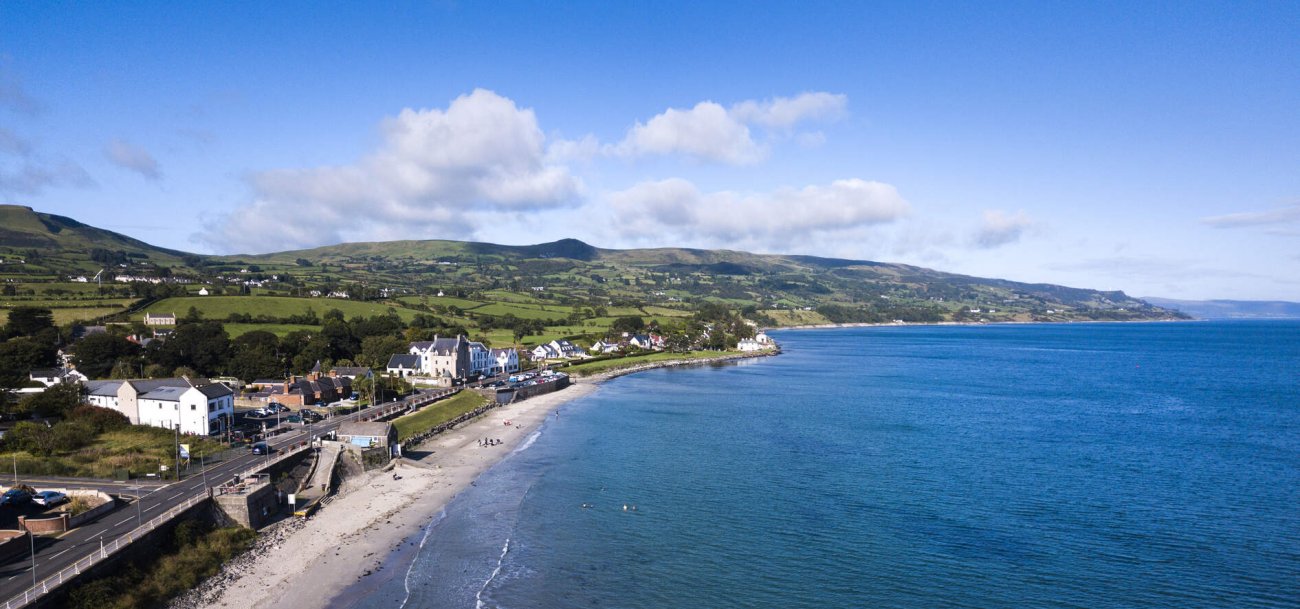 Aerial view of ballygally and the glens in the distance    tourism ireland www.thesalthousehotel.com